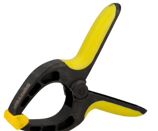 Prensa plastico con resorte 8"